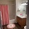 bathroom with a large mirror and ample lighting