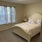 bedroom with a large window and modern decor