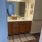 bathroom with a large mirror and ample lighting
