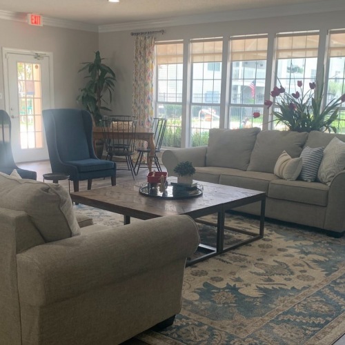 Lobby lobby with couches and open spaces and views of the pool